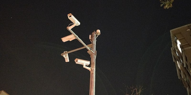 Night scene of CCTV cameras installed outside a building on a pole