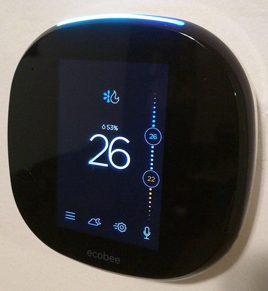 Ecobee4 on the wall from an angle showing home screen